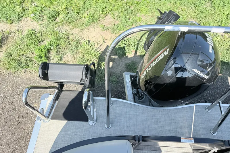 Slide: The Image of 2023 South Bay S224RS boat with Mercury outboard motor and swim ladder, viewed from above. - 18