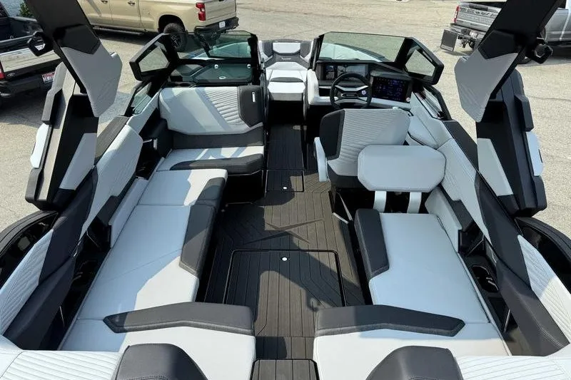 Slide: The Image of 2027 MasterCraft X23 boat interior with modern seating and dashboard design. - 8