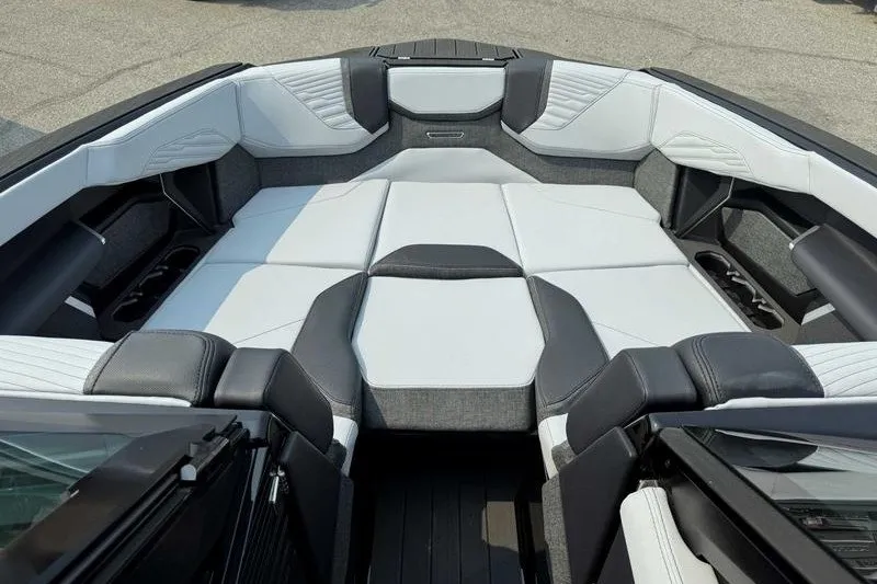 Slide: The Image of 2027 MasterCraft X23 boat interior with luxurious seating and modern design. - 15