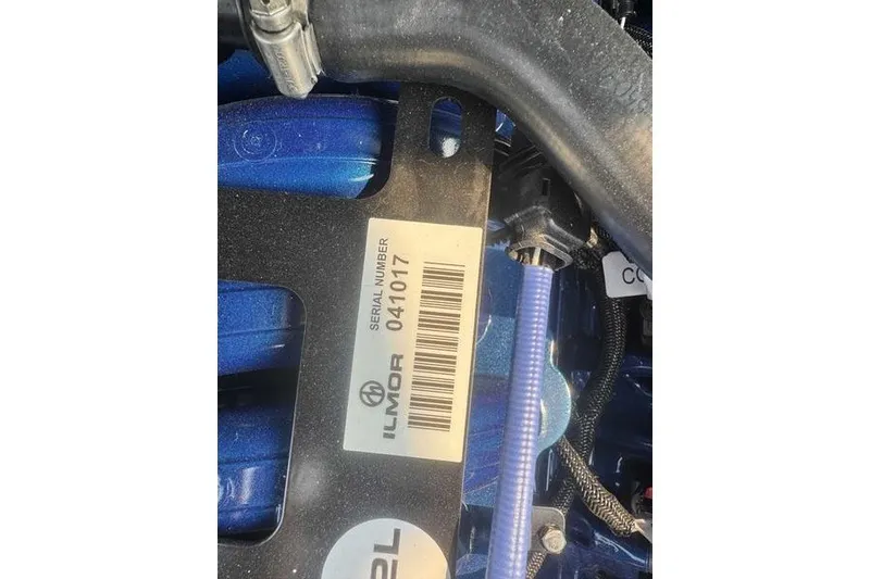 Slide: The Image of Close-up of Ilmor engine serial number on 2027 MasterCraft X23 boat. - 18