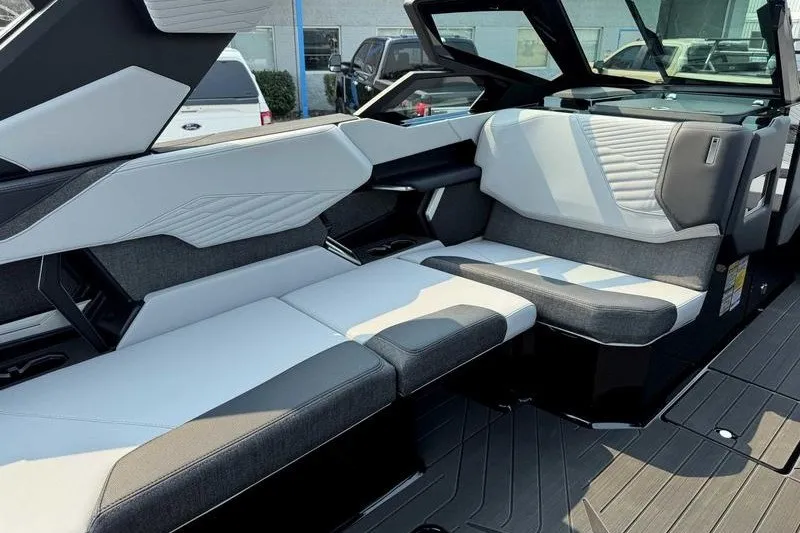 Slide: The Image of 2027 MasterCraft X23 boat interior with sleek, modern seating design. - 10