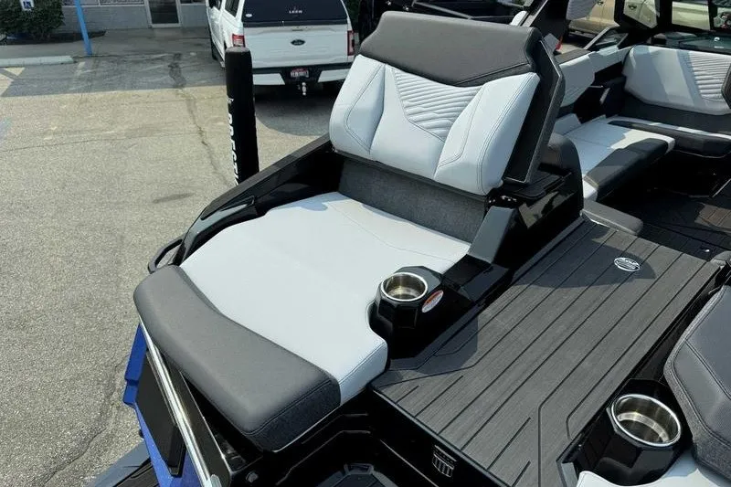 Slide: The Image of 2027 MasterCraft X23 boat interior with sleek seating and cup holders. - 4