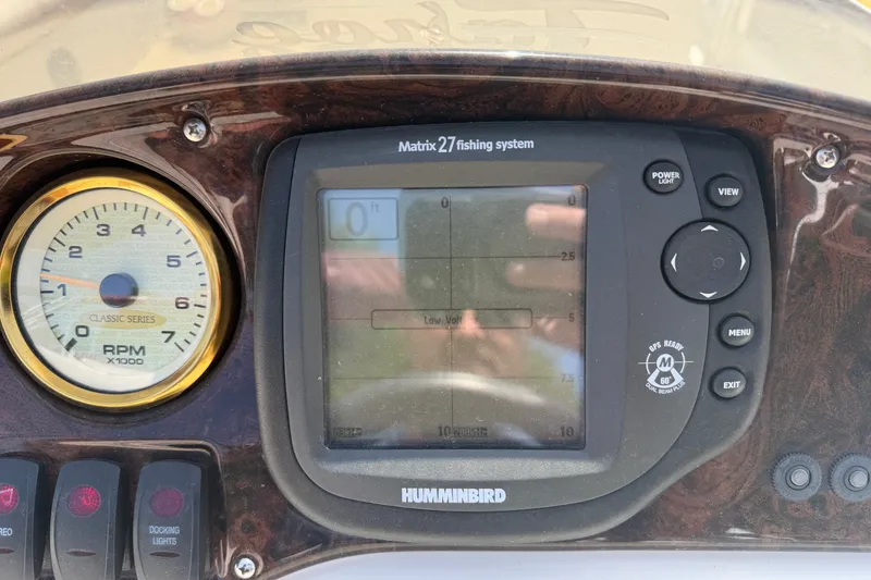 Slide: The Image of Dashboard of a 2005 Tahoe Pontoon Sierra with Humminbird Matrix 27 fishing system. - 9