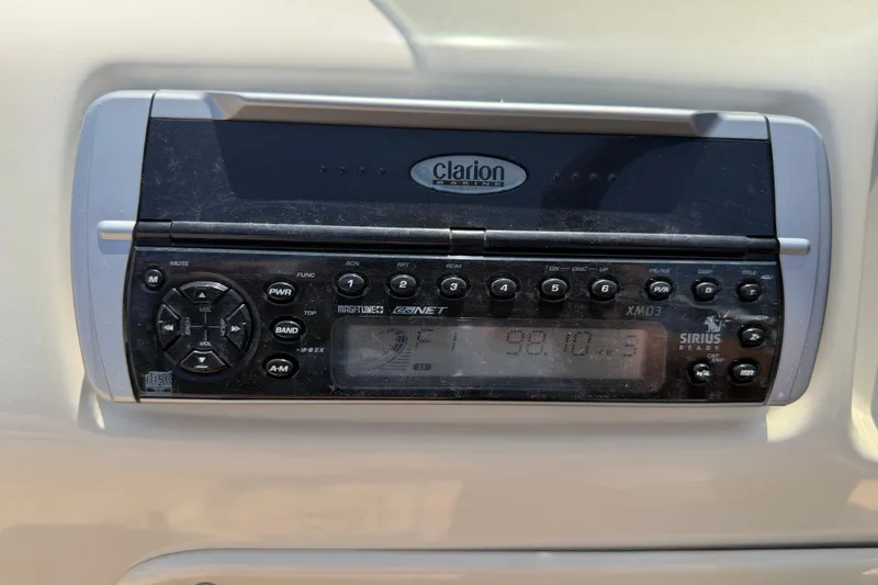 Slide: The Image of Clarion marine stereo on 2005 Tahoe Pontoon Sierra - 20', displaying FM frequency. - 10