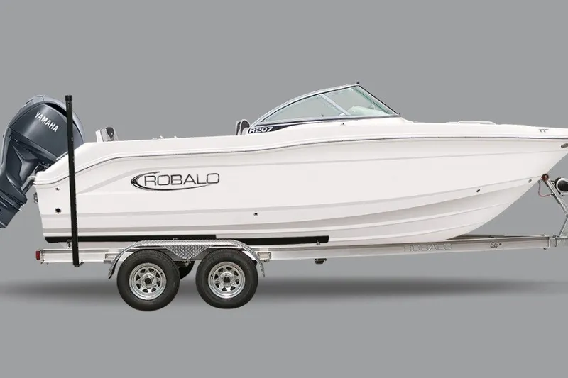 The Image of 2027 Robalo R207 Dual Console boat on trailer with Yamaha engine, side view. - 14