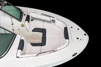 Slide: The Image of 2027 Robalo R207 Dual Console boat interior with white seating and black accents. - 9
