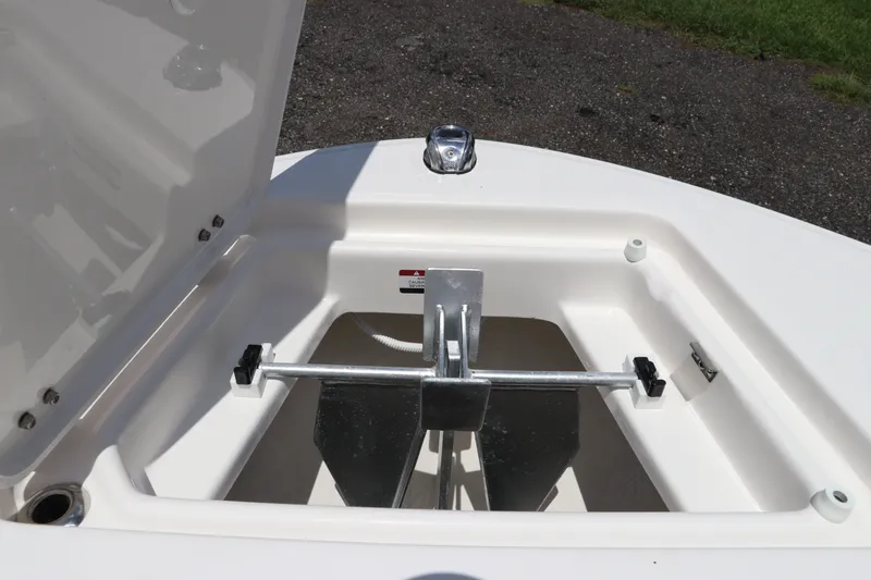 Slide: The Image of 2027 Robalo R207 Dual Console anchor storage compartment, open lid, showcasing anchor setup. - 39