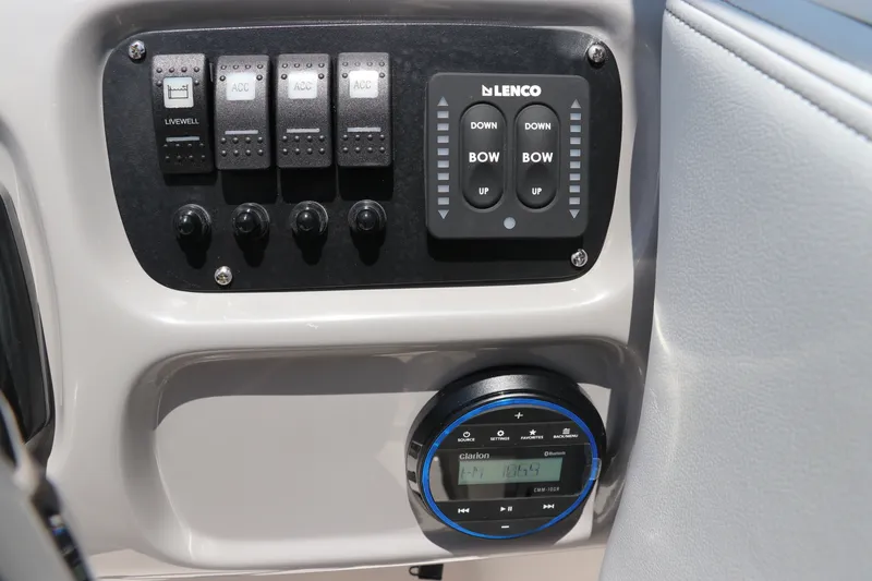 Slide: The Image of Control panel with toggle switches and Lenco control in the Robalo R207 Dual Console. - 29