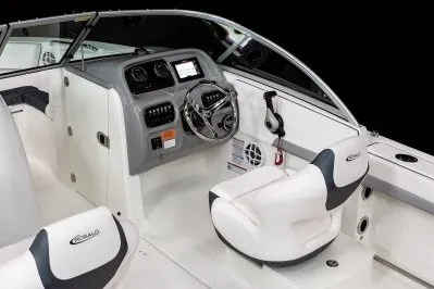 Slide: The Image of 2027 Robalo R207 Dual Console boat interior with steering wheel and seating. - 7