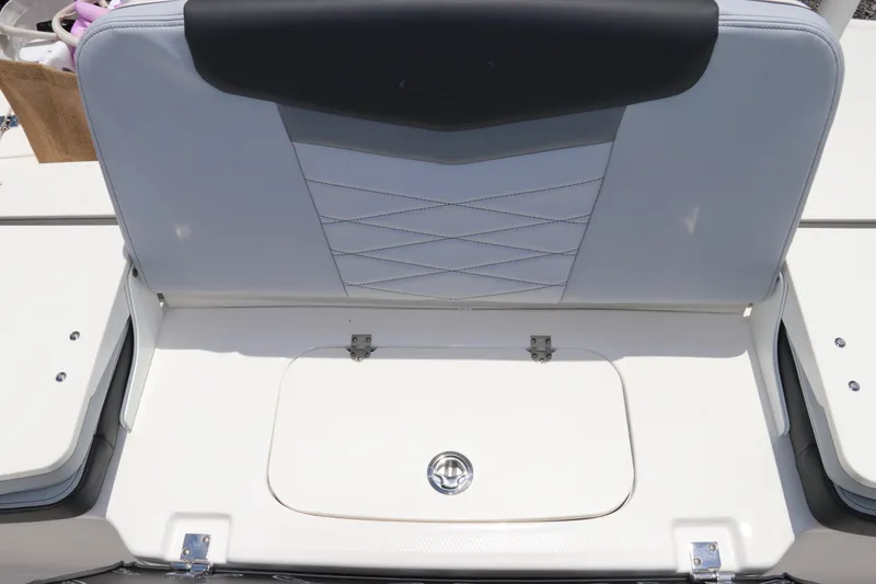 Slide: The Image of Robalo R207 Dual Console 2027: Rear seat with storage underneath, white upholstery with gray accents. - 14