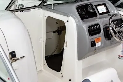 Slide: The Image of 2027 Robalo R207 Dual Console boat interior with steering wheel and control panel. - 8