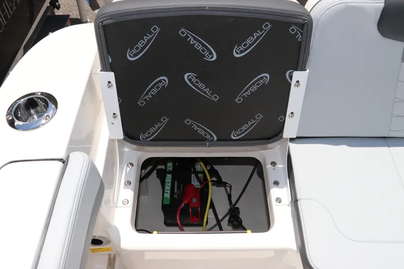 Slide: The Image of 2027 Robalo R207 Dual Console boat seat storage with battery compartment. - 13