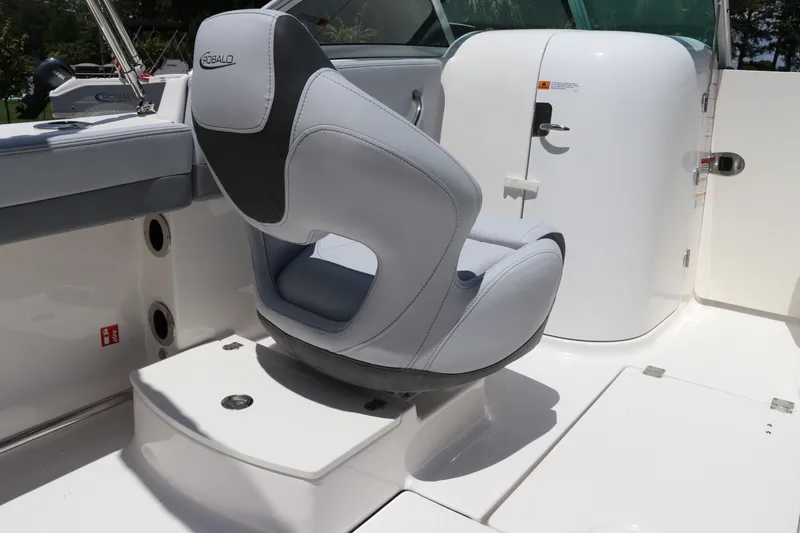 Slide: The Image of 2027 Robalo R207 Dual Console boat interior with sleek seating and modern design. - 18