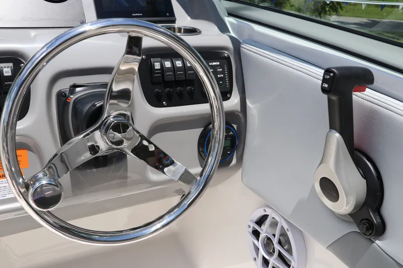 Slide: The Image of Steering wheel and controls of 2027 Robalo R207 Dual Console boat. - 30