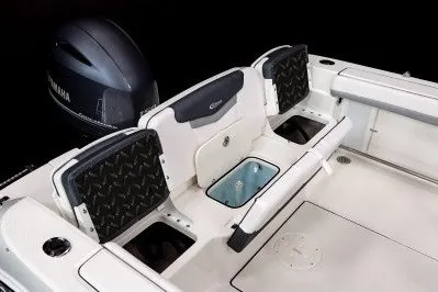 Slide: The Image of 2027 Robalo R207 Dual Console boat interior with Yamaha engine, featuring seating and storage compartments. - 4