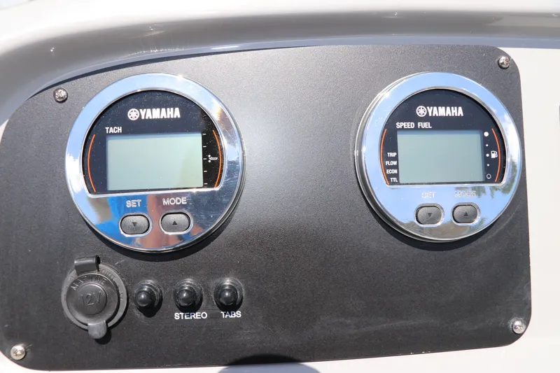 Slide: The Image of Yamaha gauges on 2027 Robalo R207 Dual Console boat dashboard. - 26