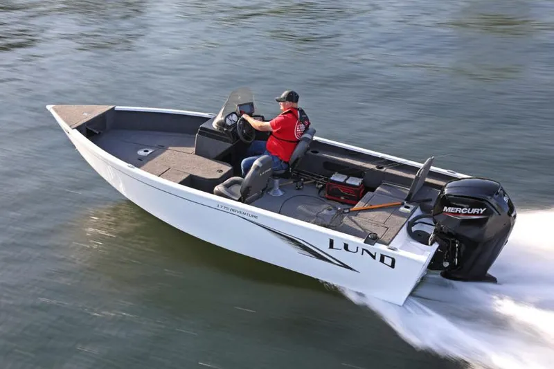 Slide: The Image of Manufacturer Provided Image: 2020 Lund 1675 Adventure SS boat speeding on water. - 15