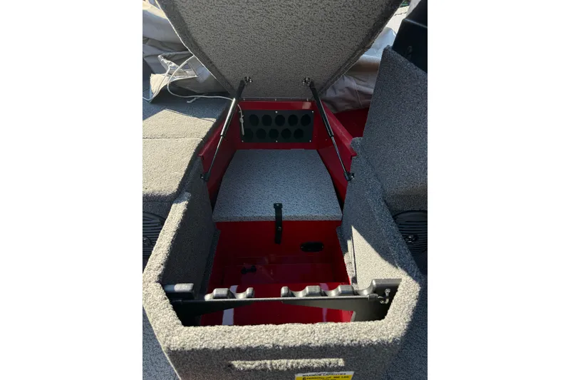 Slide: The Image of 2020 Lund 1675 Adventure SS boat interior storage compartment open. - 9