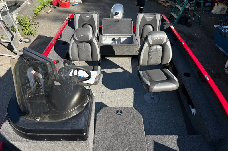 Slide: The Image of 2020 Lund 1675 Adventure SS boat interior with seating and steering console. - 12