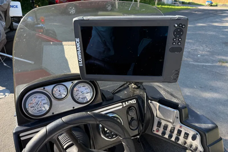 Slide: The Image of Dashboard of a 2020 Lund 1675 Adventure SS boat with Lowrance display and gauges. - 13