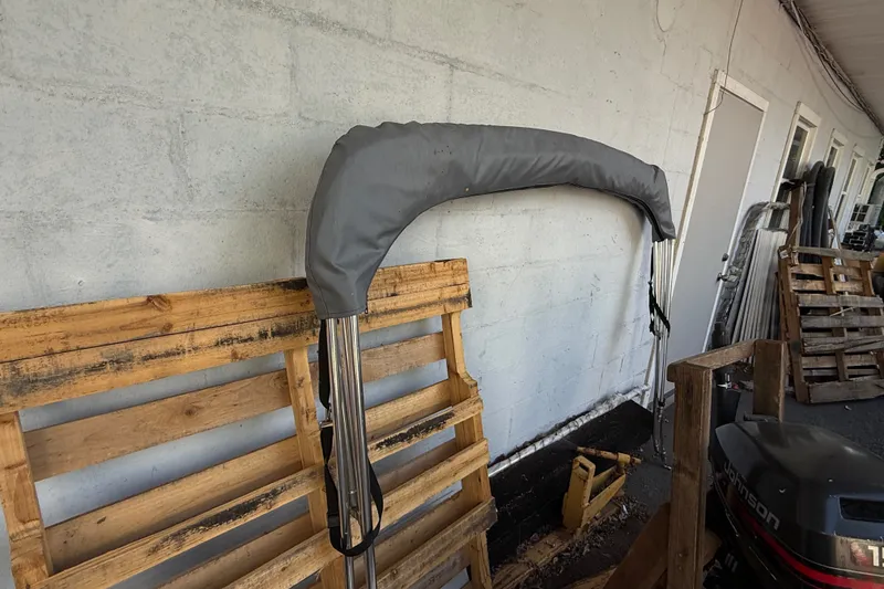 Slide: The Image of Covered boat canopy frame for 2020 Lund 1675 Adventure SS, stored against a wall. - 28