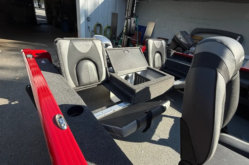Slide: The Image of 2020 Lund 1675 Adventure SS boat interior with seating and storage compartments. - 7