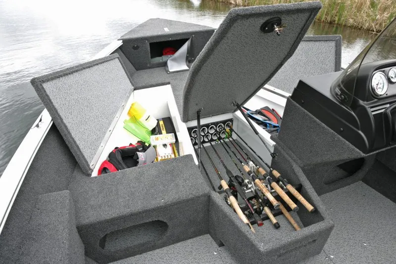 Slide: The Image of Manufacturer Provided Image: 2020 Lund 1675 Adventure SS boat with open storage compartments and fishing rods. - 18