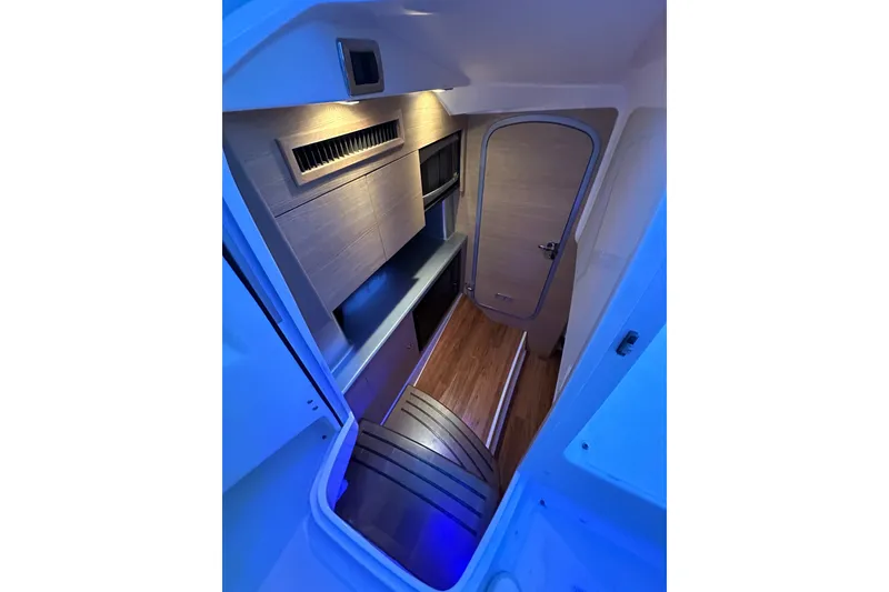 Slide: The Image of Interior cabin of 2013 Chaparral 327 SSX boat with modern wood finish. - 42