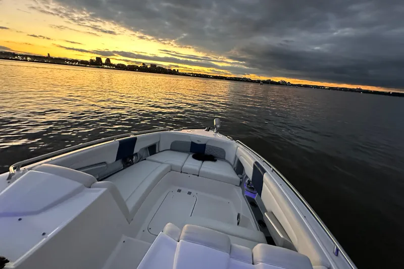 Slide: The Image of 2013 Chaparral 327 SSX boat at sunset on calm waters. - 29