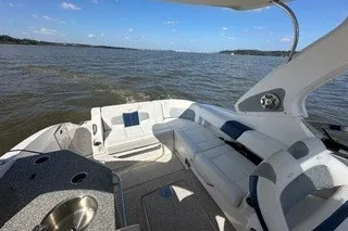 Slide: The Image of 2013 Chaparral 327 SSX boat interior with luxurious seating on open water. - 16