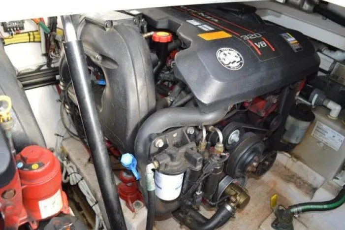 Slide: The Image of Engine compartment of a 2013 Chaparral 327 SSX boat, featuring a V8 engine. - 53