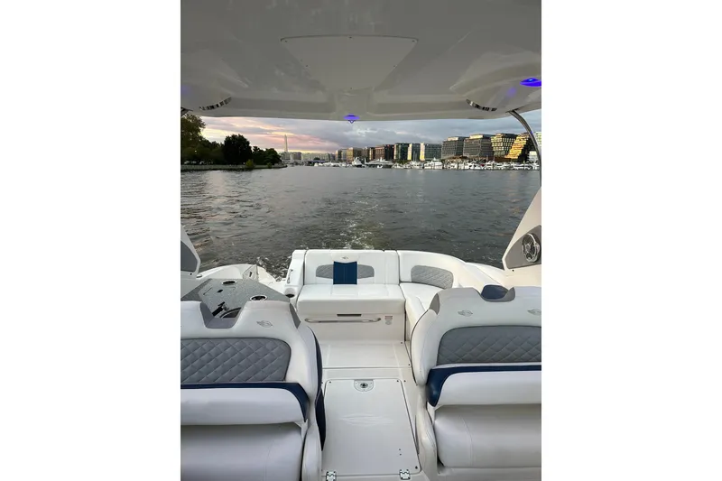Slide: The Image of 2013 Chaparral 327 SSX boat interior with waterfront cityscape view. - 19