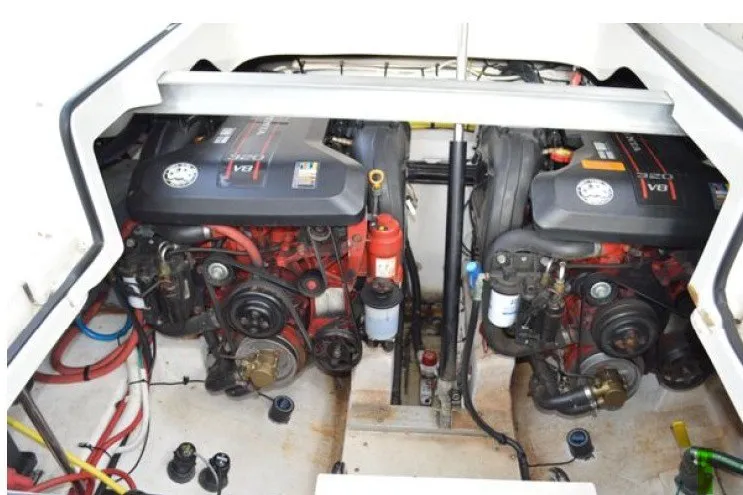 Slide: The Image of Engine compartment of 2013 Chaparral 327 SSX boat, featuring dual V8 engines. - 51
