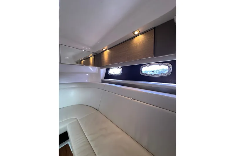Slide: The Image of Interior of 2013 Chaparral 327 SSX boat with elegant seating and modern lighting. - 41