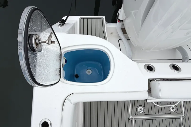 Slide: The Image of Open hatch on 2026 Tidewater 320 CC Adventure boat, revealing blue interior compartment. - 47