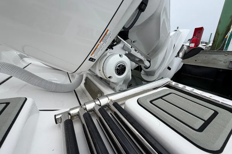 Slide: The Image of 2026 Tidewater 320 CC Adventure boat engine and deck details at dock. - 27