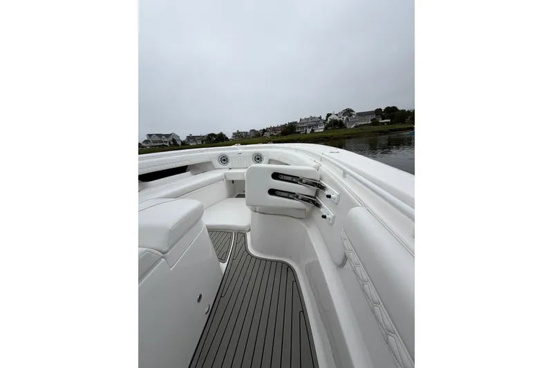 Slide: The Image of 2026 Tidewater 320 CC Adventure boat interior with sleek seating and modern design. - 53