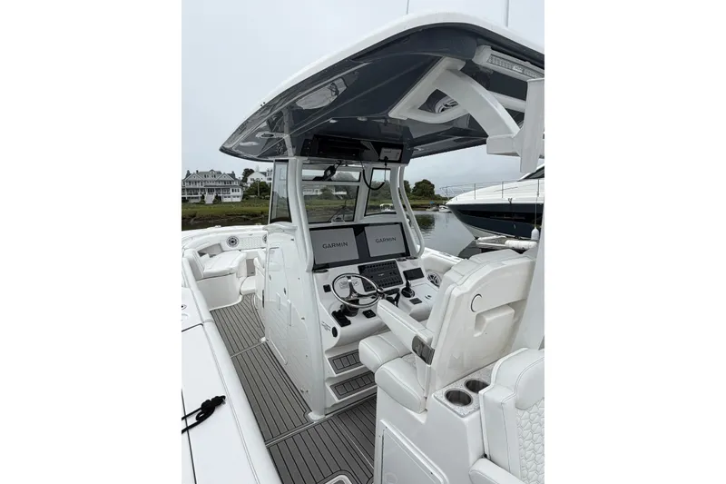 Slide: The Image of 2026 Tidewater 320 CC Adventure boat interior with Garmin navigation system. - 54
