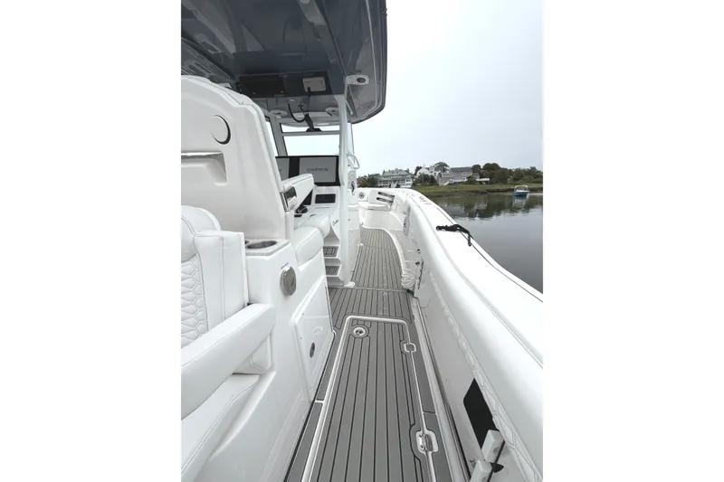 Slide: The Image of 2026 Tidewater 320 CC Adventure boat interior with sleek design and advanced navigation system. - 59