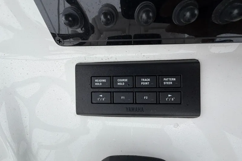 Slide: The Image of Control panel of a 2026 Tidewater 320 CC Adventure boat with Yamaha navigation buttons. - 18