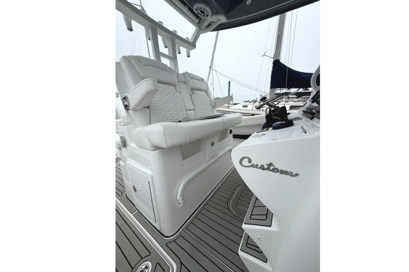Slide: The Image of 2026 Tidewater 320 CC Adventure boat interior with custom seating and sleek design. - 61