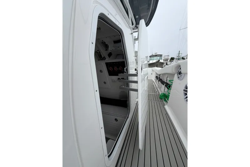 Slide: The Image of 2026 Tidewater 320 CC Adventure boat interior and deck view. - 23