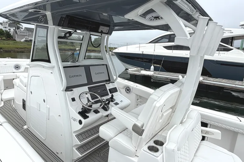 Slide: The Image of 2026 Tidewater 320 CC Adventure boat interior with Garmin navigation system. - 25