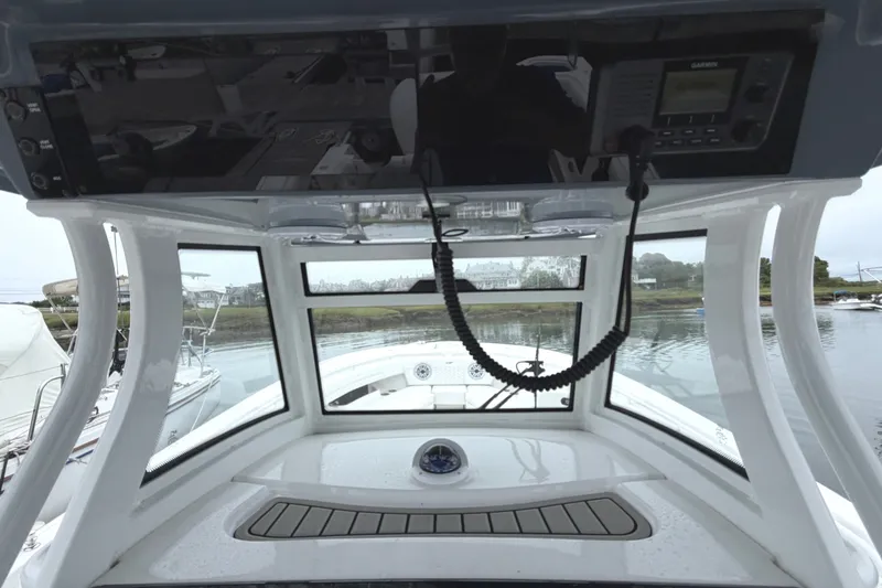 Slide: The Image of Interior view of 2026 Tidewater 320 CC Adventure boat cockpit with navigation equipment. - 64