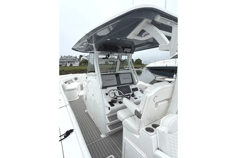 Slide: The Image of 2026 Tidewater 320 CC Adventure boat interior with advanced Garmin navigation system. - 40