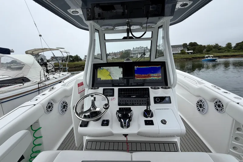 Slide: The Image of Cockpit of 2026 Tidewater 320 CC Adventure boat with advanced navigation systems. - 39