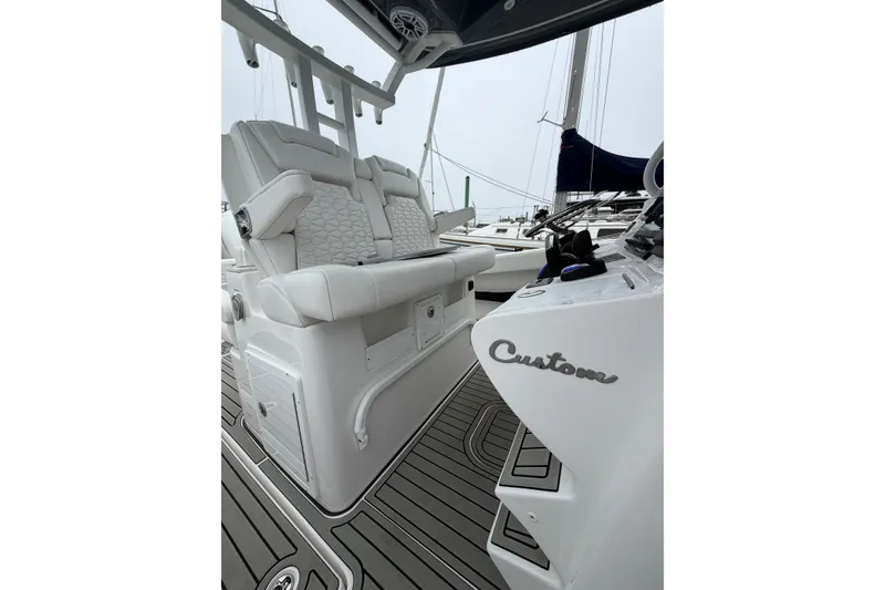 Slide: The Image of 2026 Tidewater 320 CC Adventure boat interior with custom seating and sleek design. - 24