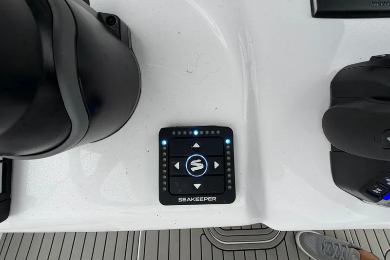 Slide: The Image of Control panel on 2026 Tidewater 320 CC Adventure boat deck with Seakeeper system. - 26