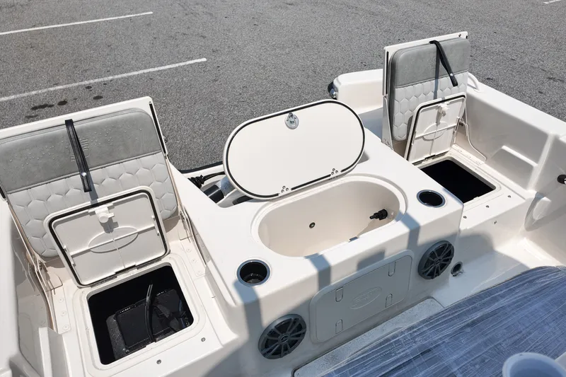 Slide: The Image of 2027 Carolina Skiff 21LS boat interior with storage compartments and seating. - 5
