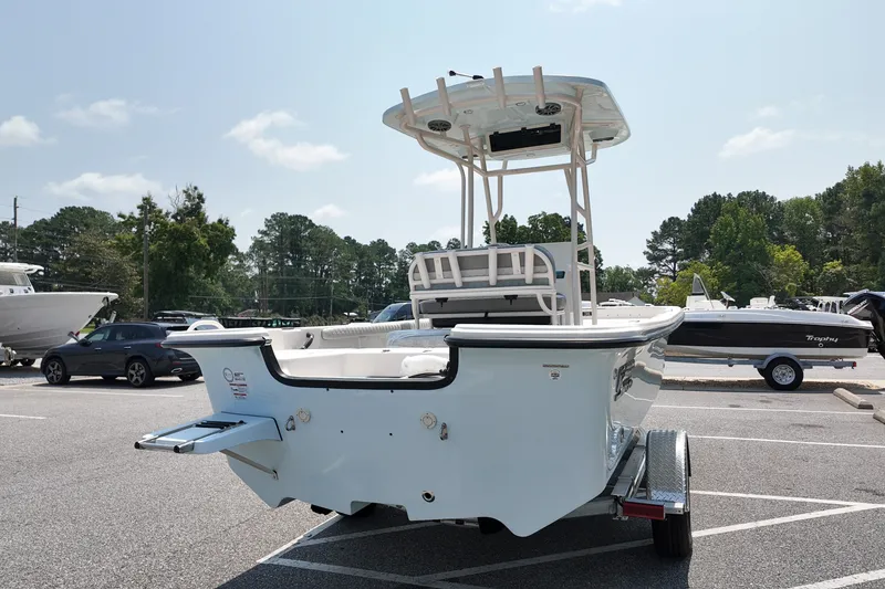 Slide: The Image of 2027 Carolina Skiff 21LS boat on trailer in parking lot, sunny day. - 4